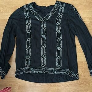 Vintage medium beaded, black, and silver top zips in the back